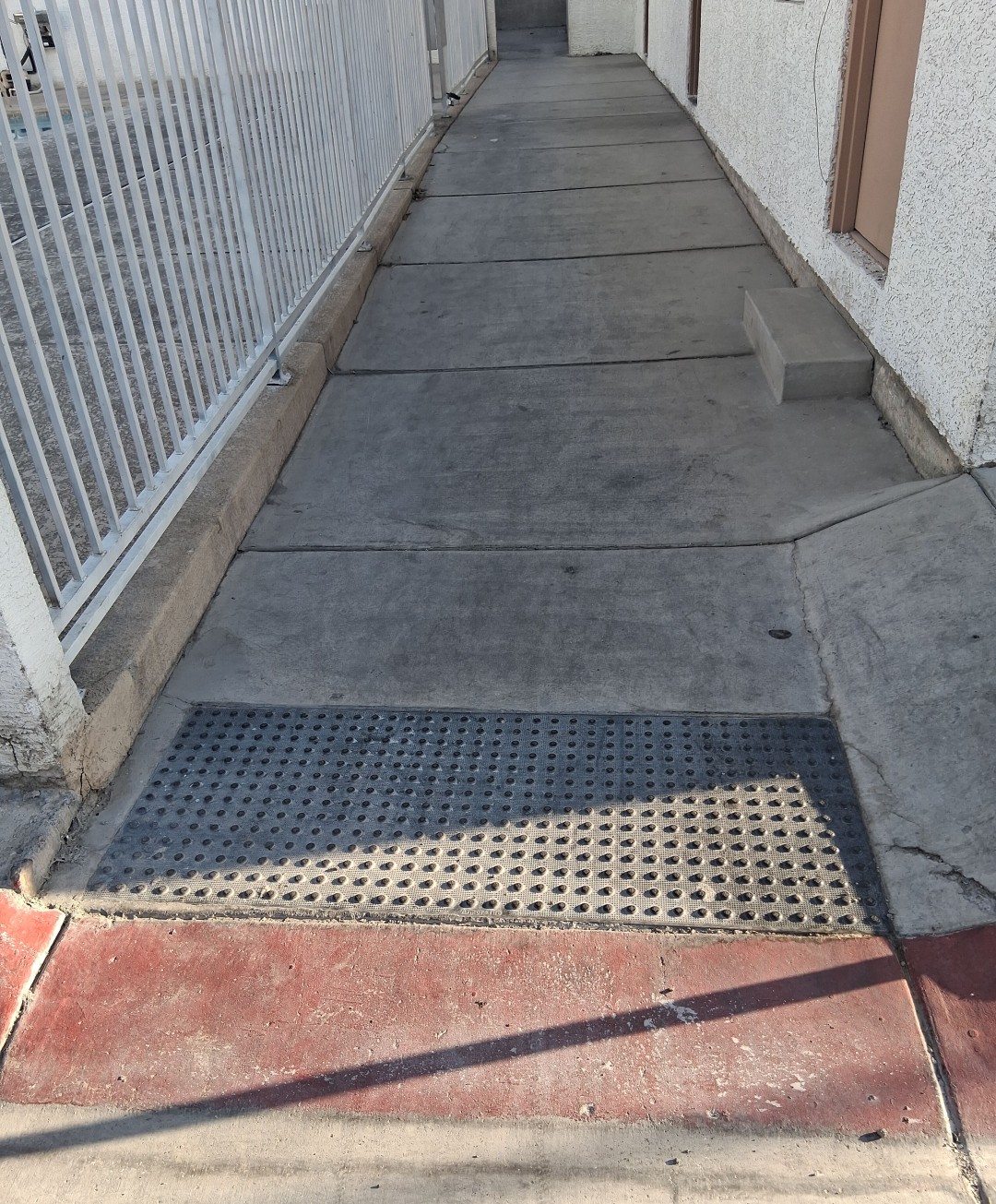 Soiled commercial pavement before pressure washing